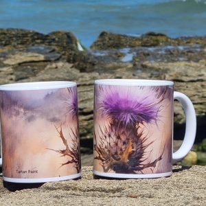 Ceramic mug with single Scottish thistle on a misty Highlands background