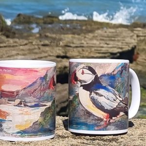 Scottish puffin coffee mug, coastal bird illustration, puffin-themed drinkware, Scotland wildlife gift, vibrant seabird artwork, Isle of Mull scenery, unique Scottish gifts, nature-inspired home accessories, puffin lover’s ceramic mug, Scotland-themed kitchenware