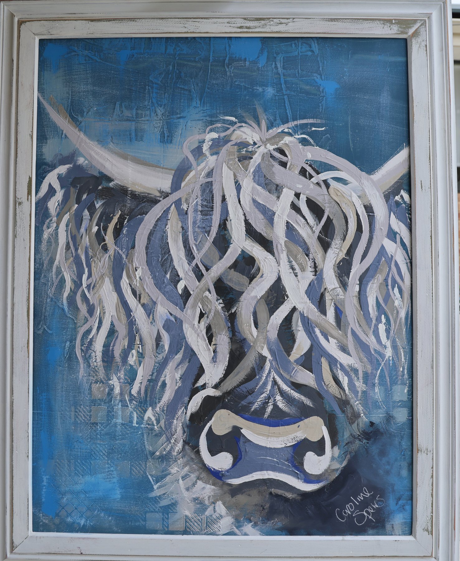 Bluebell, an original Highland cow painting in blues and greys by Perth artist Caroline Speirs, in a white washed frame