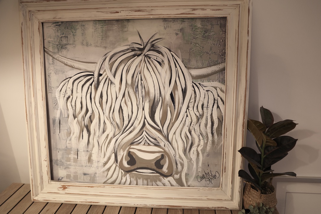 Skye, an original white Highland cow painting by Caroline Speirs, in a distressed white timber frame, signed bottom right